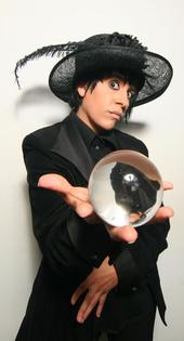 eveghost of Scarlet's Remains holds a glass orb in their hand extended toward the camera.